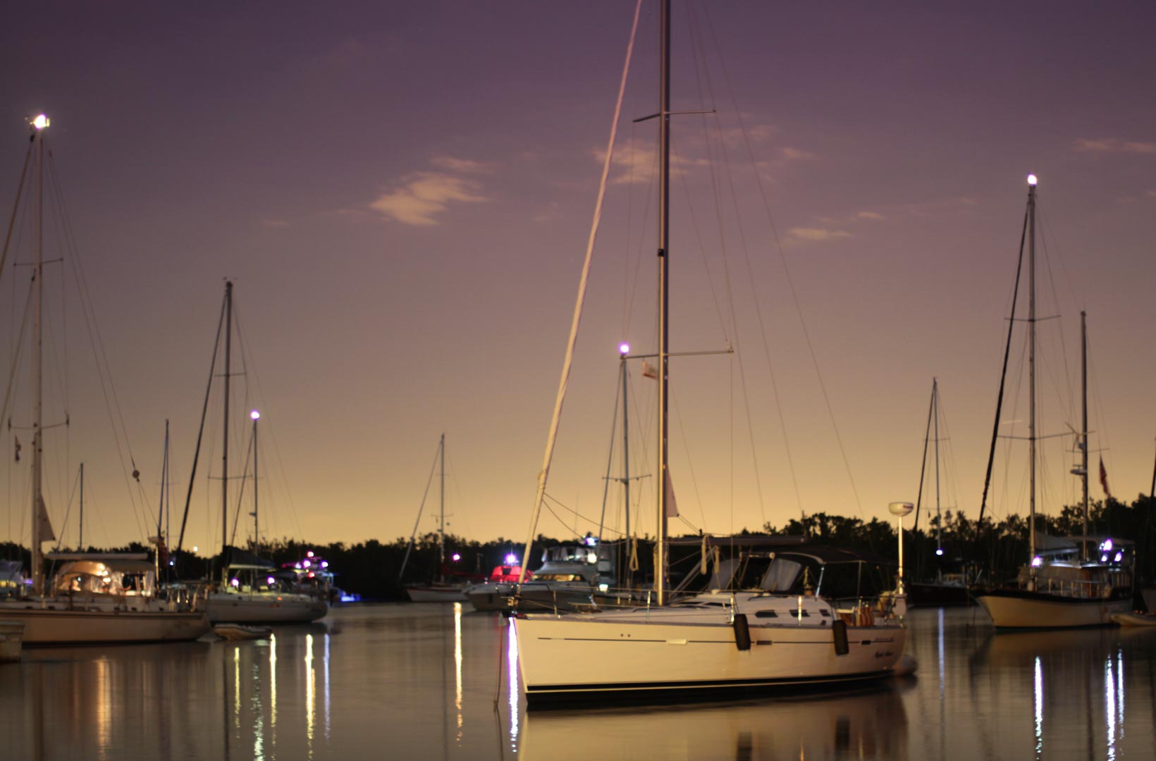 image of boats anchored in No Name Harbor at night